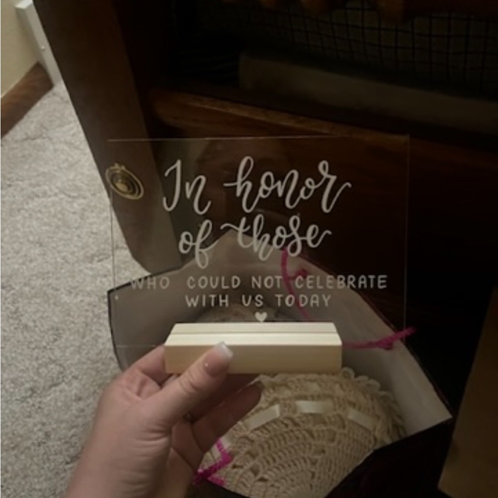 “In honor of those who could not celebrate with us today” acrylic sign